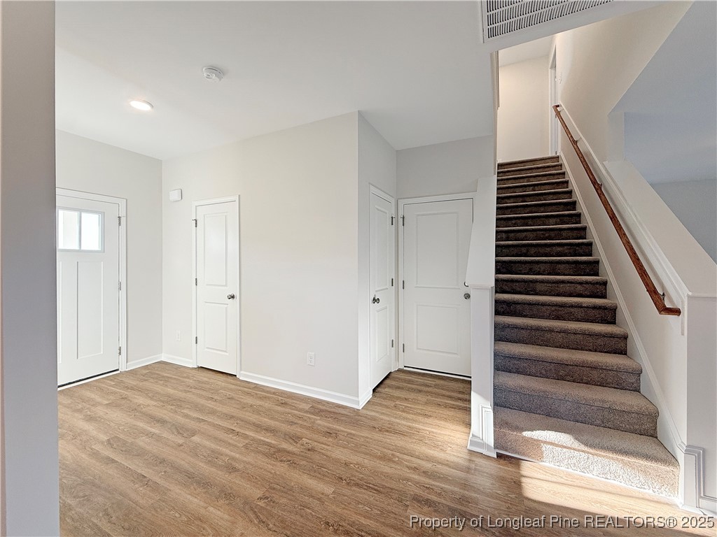 514 Ashley Heights Raeford, NC 28376 - Photo 6 of 39 a view of a room with wooden floor and white walls