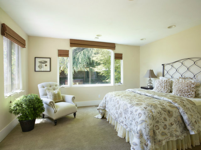 215 Channing Road Burlingame, CA 94010 - Photo 6 of 11 a bed sitting in a bedroom next to a window with potted plant
