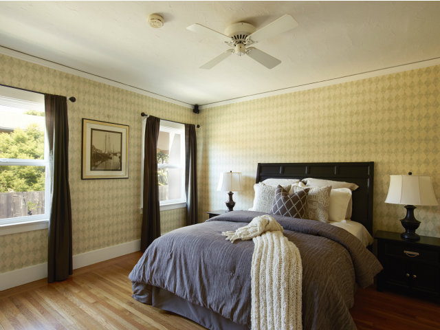 215 Channing Road Burlingame, CA 94010 - Photo 8 of 11 a bedroom with a bed and a window