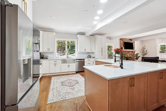 a kitchen with a sink stove and refrigerator