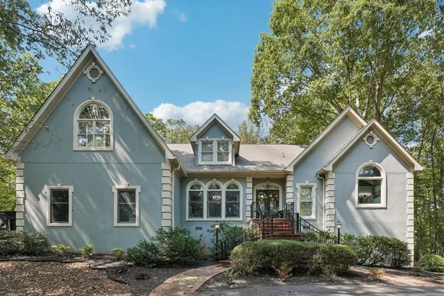 a front view of a house with garden