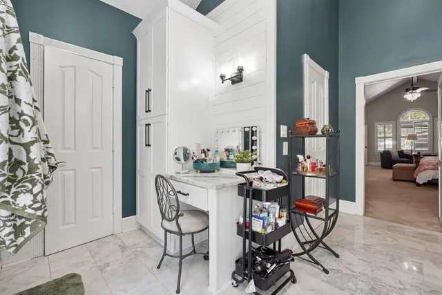 a dining room with furniture and wooden floor