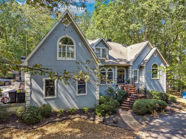 a front view of a house with garden