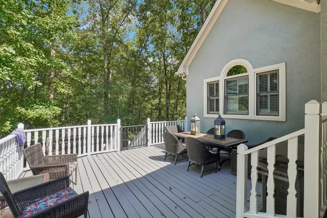 a view of a deck with a table and chairs
