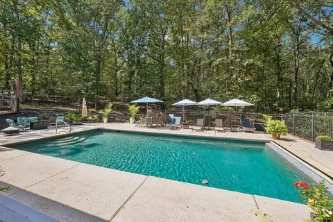 a view of a swimming pool with a patio