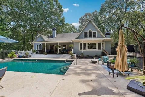 a front view of a house with a yard table and chairs