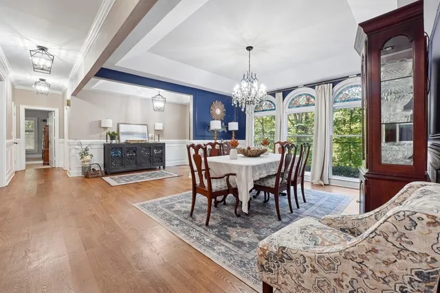 a view of a dining room with furniture window and wooden floor