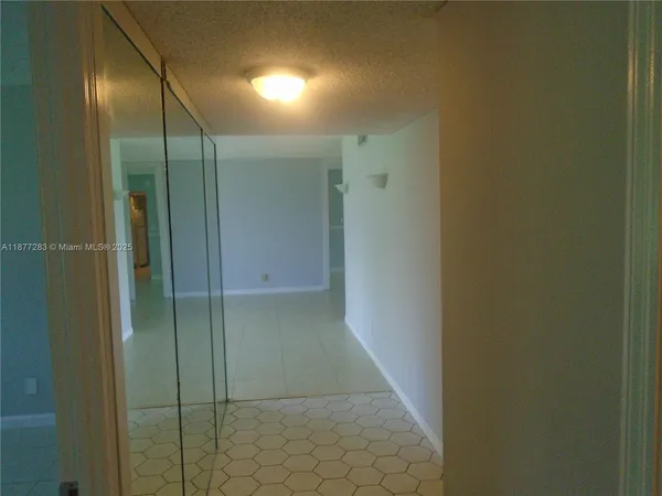 a bathroom with a glass door shower