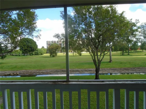 a view of porch with a floor to ceiling window and outside view