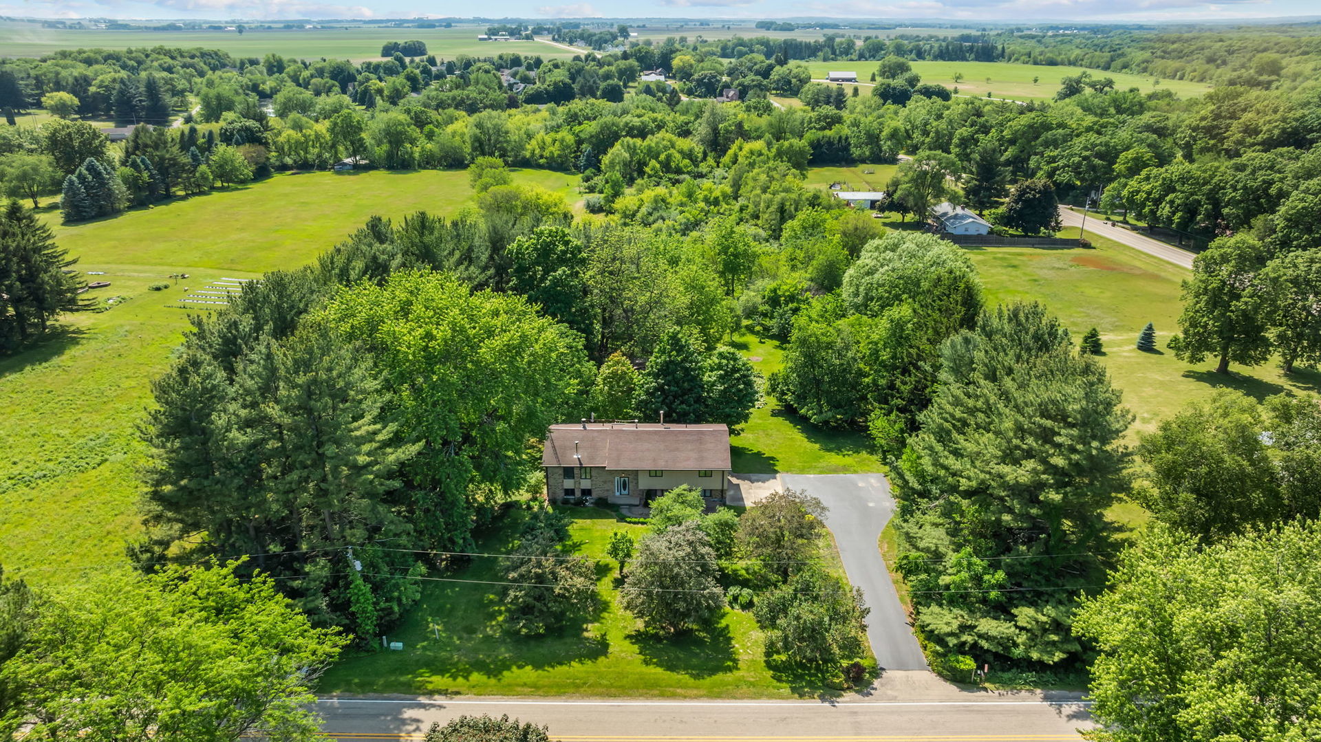 5748 South Skare Road Rochelle, IL 61068 - Photo 41 of 45 an aerial view of a house with a yard