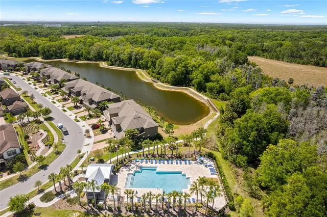 an aerial view of a house with a lake view