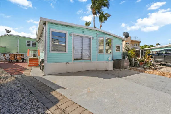 a front view of a house with a patio