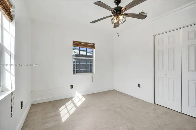 an empty room with fan