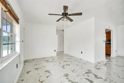 a view of a hallway to a bedroom