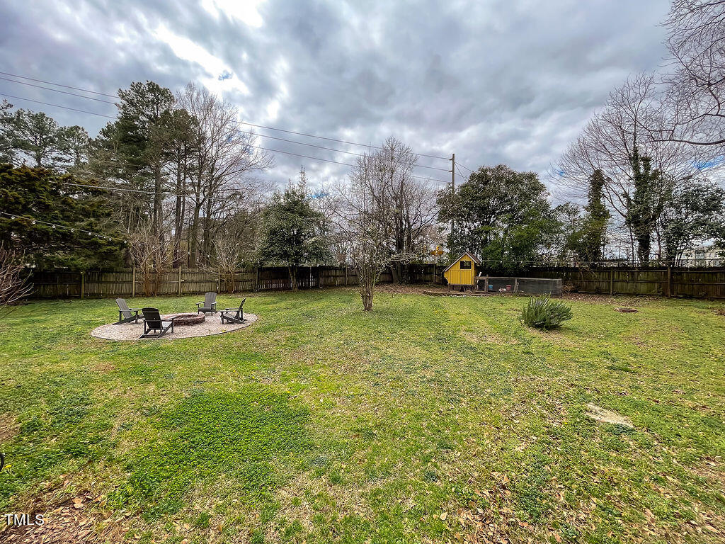 301 Colleton Road Raleigh, NC 27610 - Photo 13 of 14 a view of a swimming pool with a yard