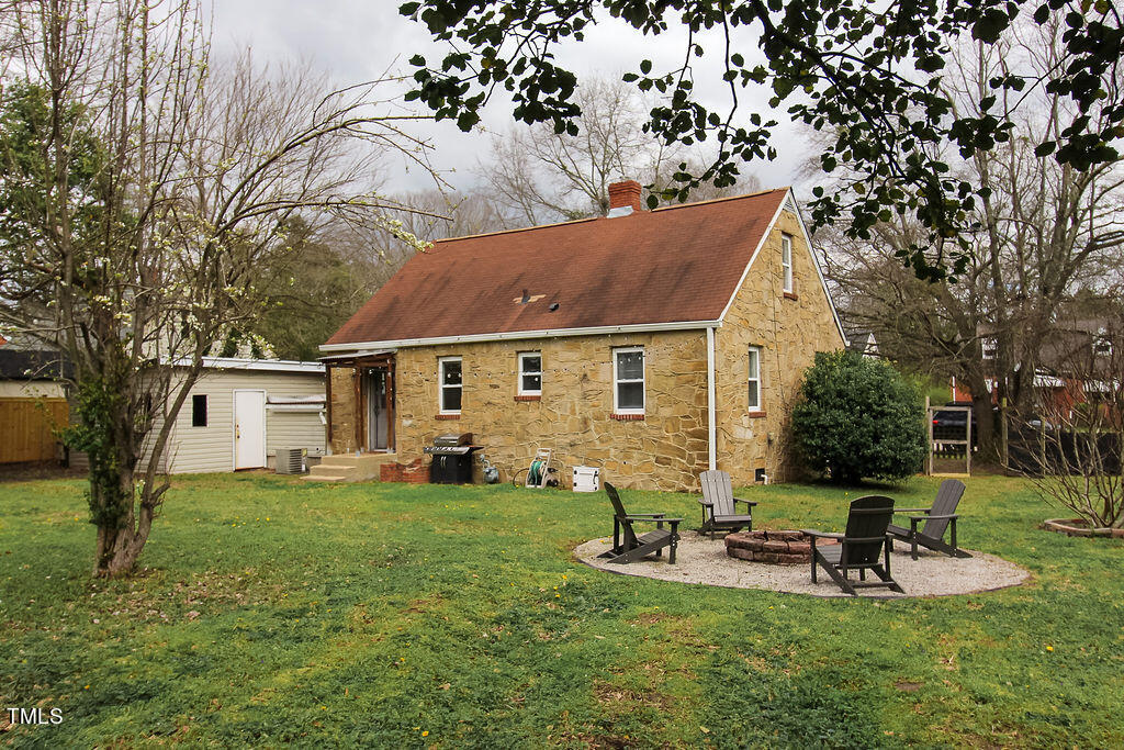 301 Colleton Road Raleigh, NC 27610 - Photo 14 of 14 a view of a house with backyard porch and sitting area