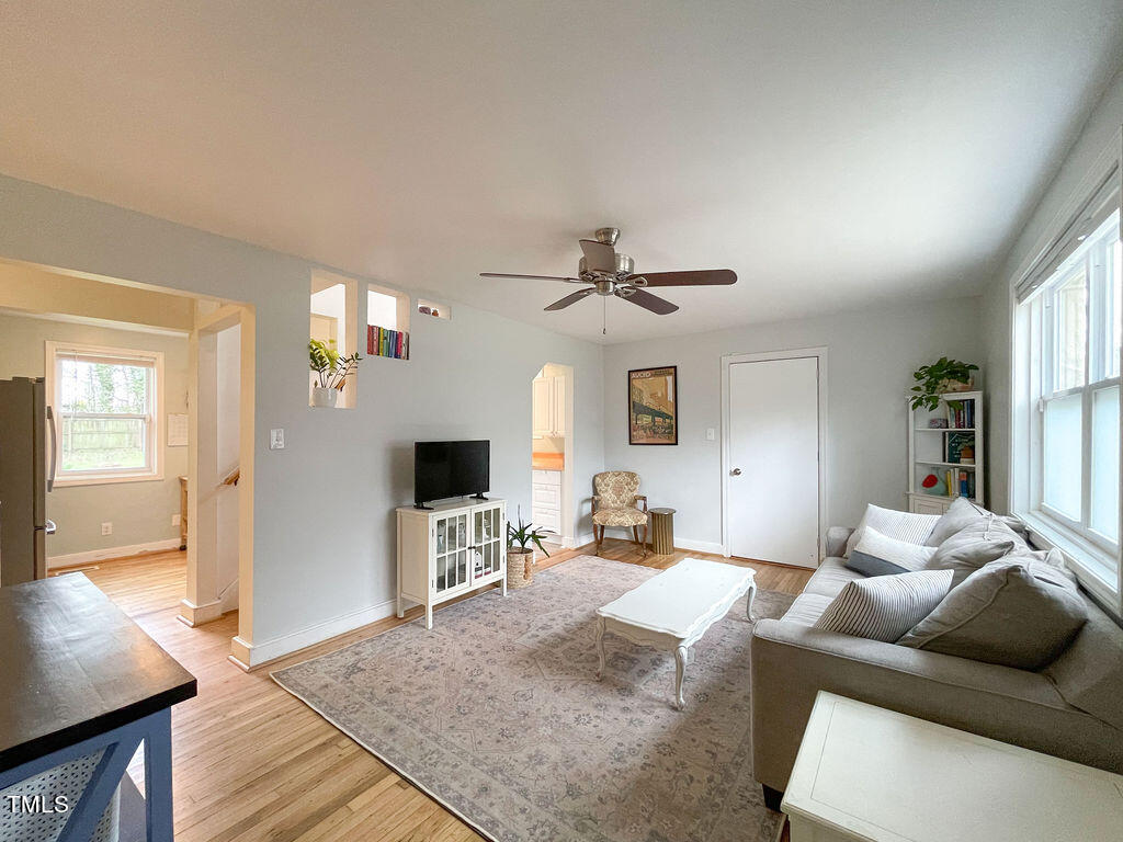 301 Colleton Road Raleigh, NC 27610 - Photo 2 of 14 a living room with furniture and a flat screen tv