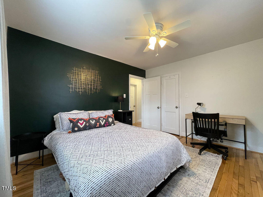 301 Colleton Road Raleigh, NC 27610 - Photo 7 of 14 a bedroom with a bed and a table in it