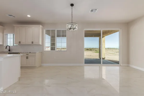 a kitchen with granite countertop cabinets stainless steel appliances a sink and wooden floor