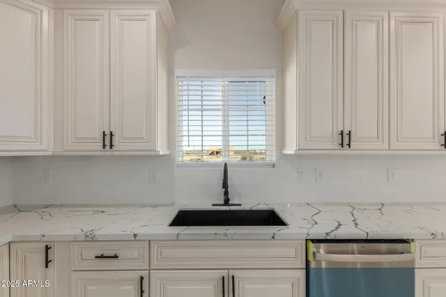 a view of a livingroom with a ceiling fan and window