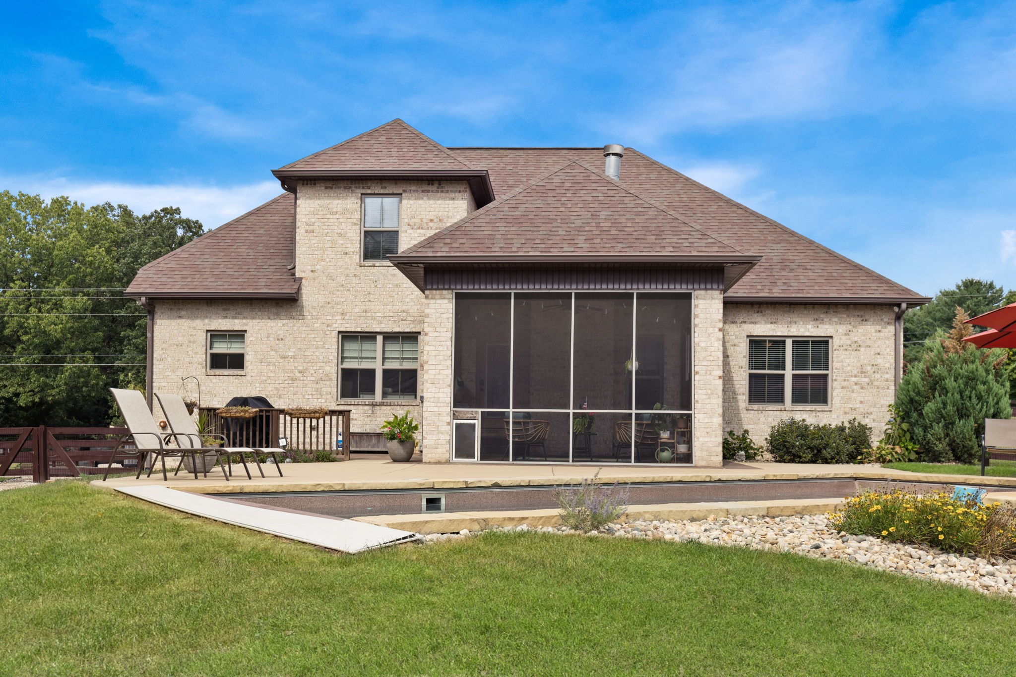2750 New Hall Road Greenbrier, TN 37073 - Photo 54 of 65 a front view of a house with a yard patio and fire pit