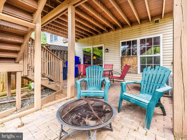 a front view of a house with outdoor seating