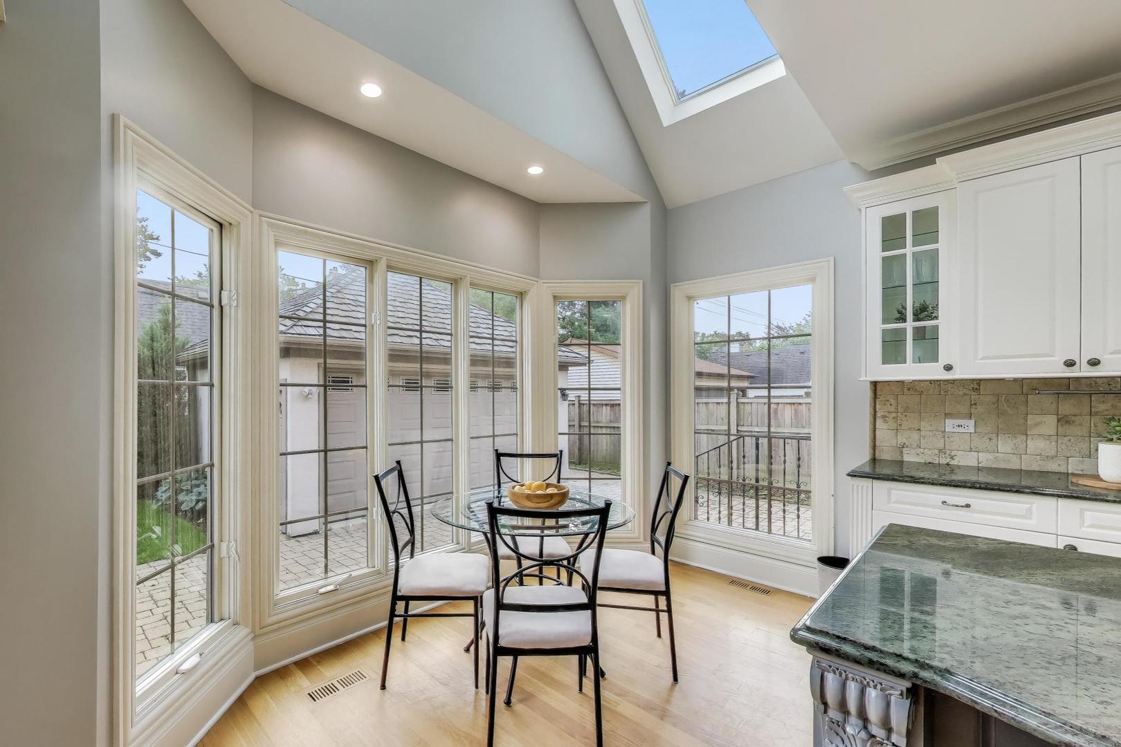 621 North County Line Road Hinsdale, IL 60521 - Photo 15 of 59 a dining room with furniture and wooden floor