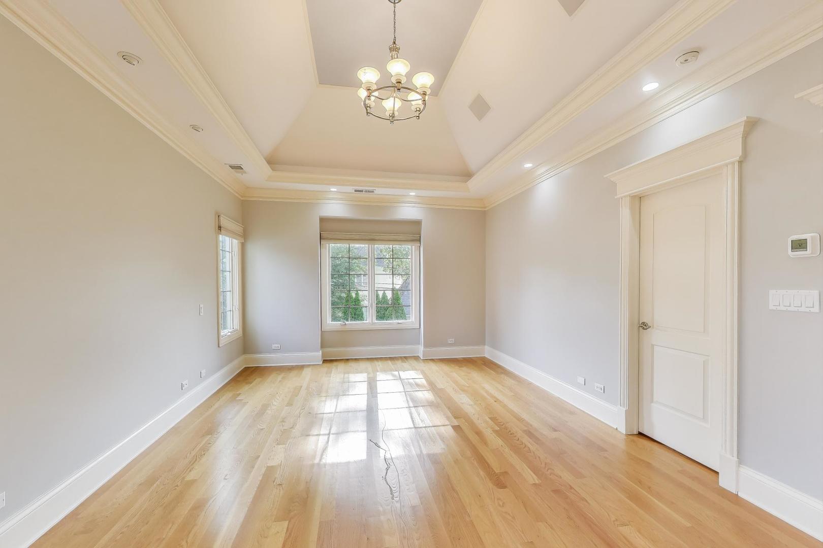 621 North County Line Road Hinsdale, IL 60521 - Photo 24 of 59 a view of empty room with wooden floor and fan