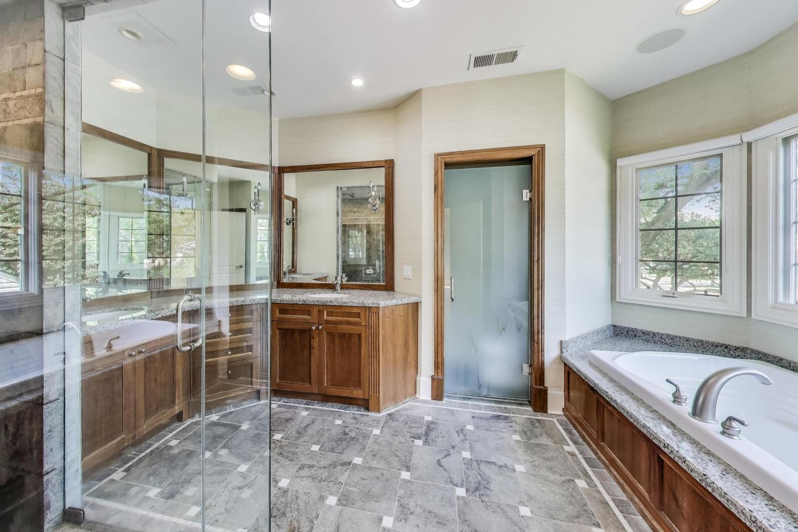 621 North County Line Road Hinsdale, IL 60521 - Photo 29 of 59 a bathroom with a granite countertop tub sink shower and mirror