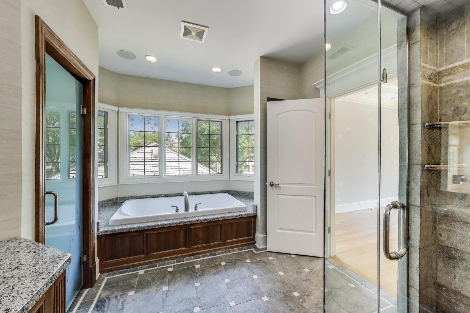 621 North County Line Road Hinsdale, IL 60521 - Photo 30 of 59 a bathroom with a tub and a sink