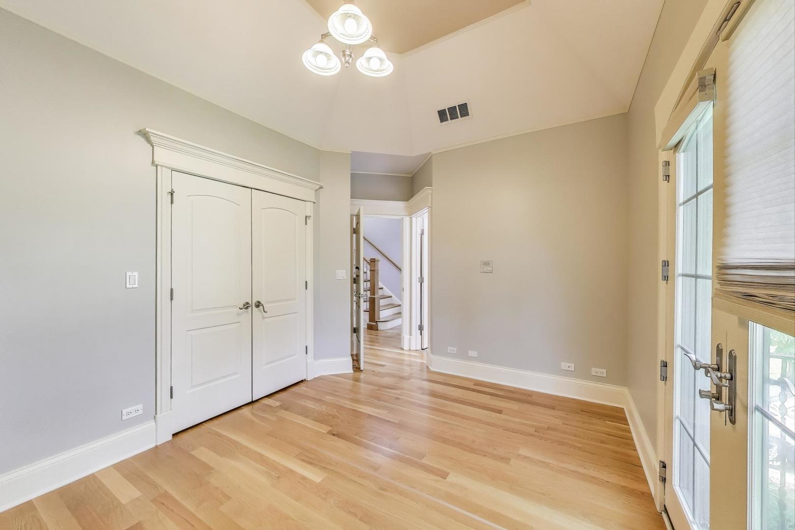 621 North County Line Road Hinsdale, IL 60521 - Photo 34 of 59 a view of an empty room with wooden floor