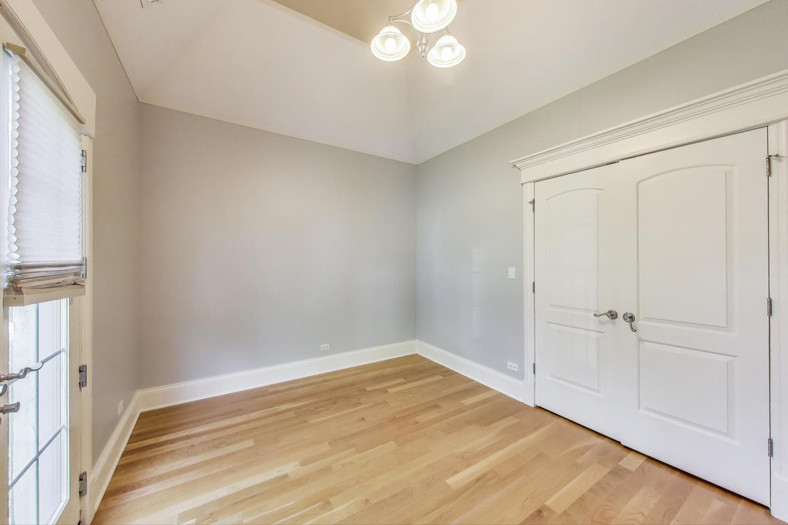 621 North County Line Road Hinsdale, IL 60521 - Photo 35 of 59 a view of empty room with wooden floor and fan