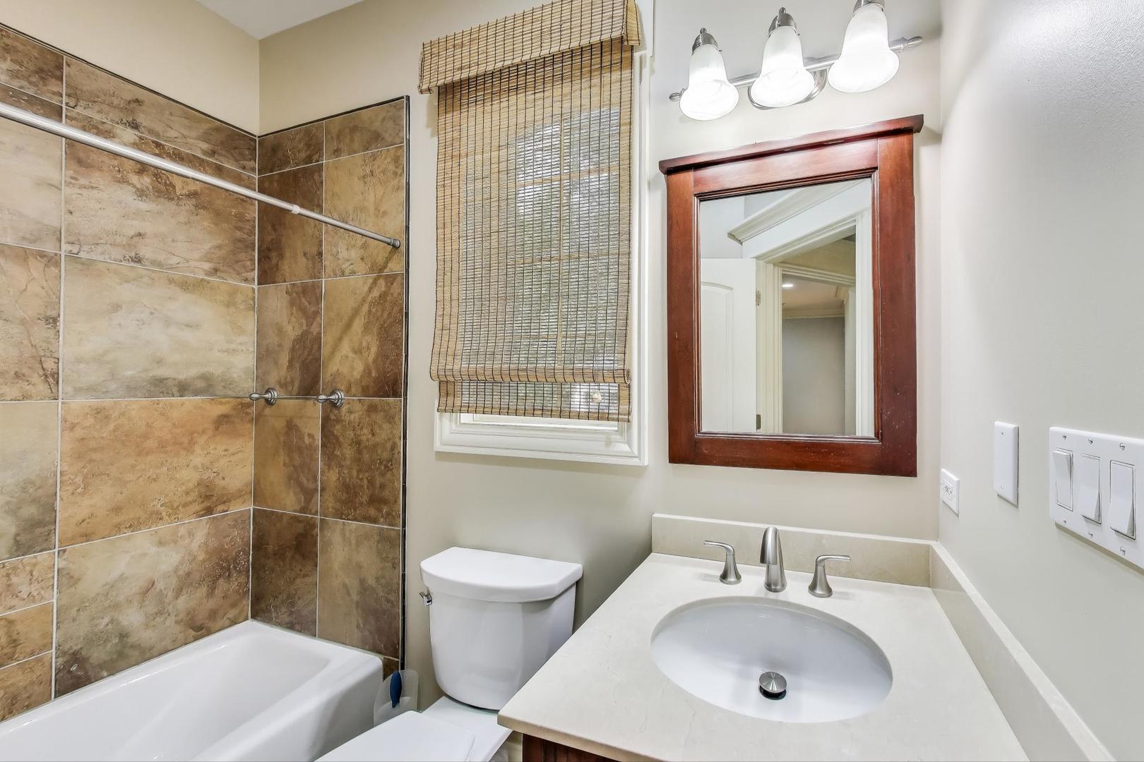 621 North County Line Road Hinsdale, IL 60521 - Photo 36 of 59 a bathroom with a sink toilet and shower