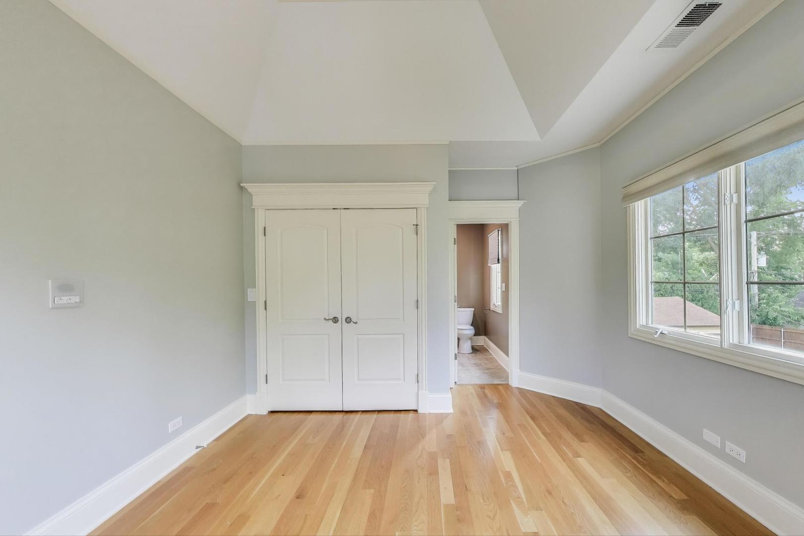 621 North County Line Road Hinsdale, IL 60521 - Photo 42 of 59 a view of a livingroom with wooden floor and a window