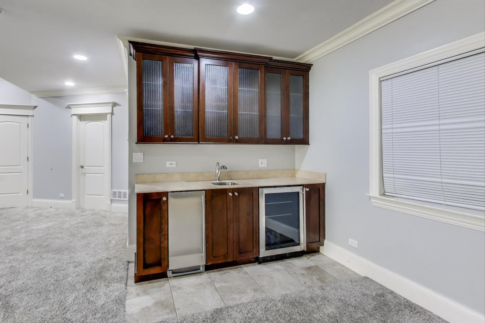 621 North County Line Road Hinsdale, IL 60521 - Photo 51 of 59 a view of an empty room with window and kitchen area