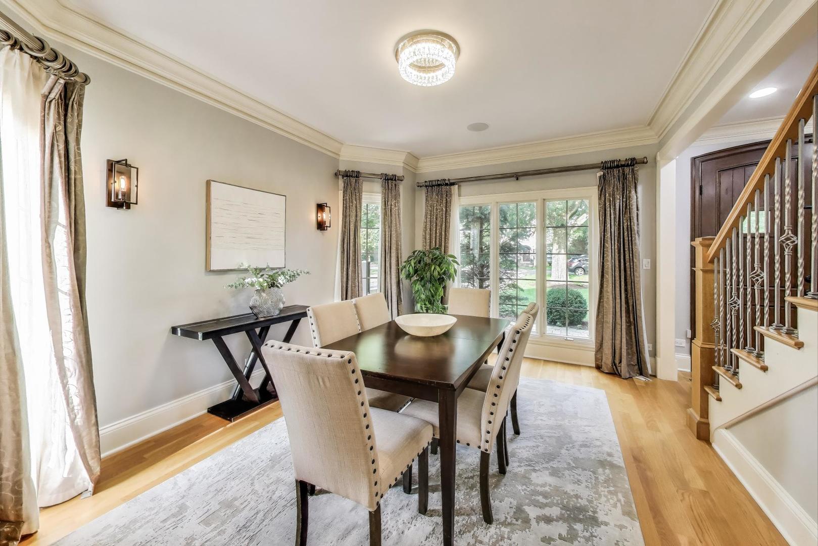 621 North County Line Road Hinsdale, IL 60521 - Photo 10 of 59 a view of a dining room with furniture window and wooden floor