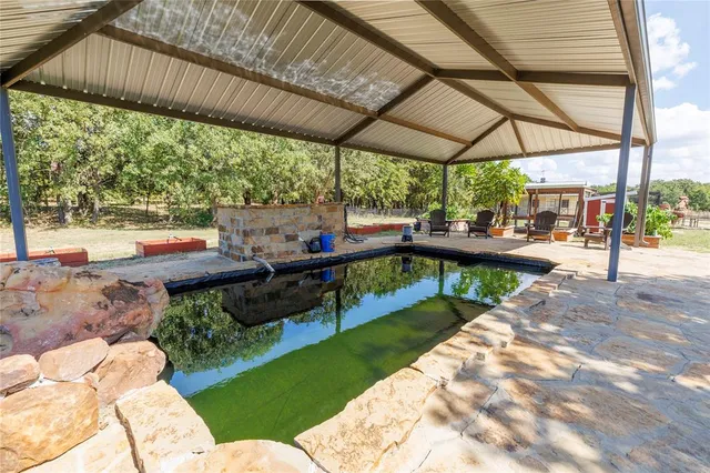 a view of yard with patio