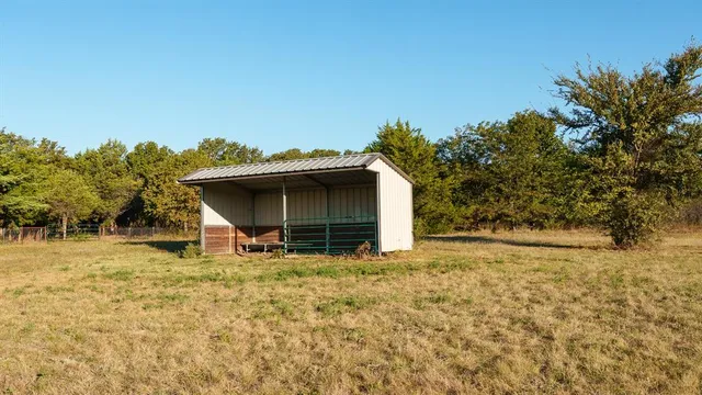 a house with trees in the background
