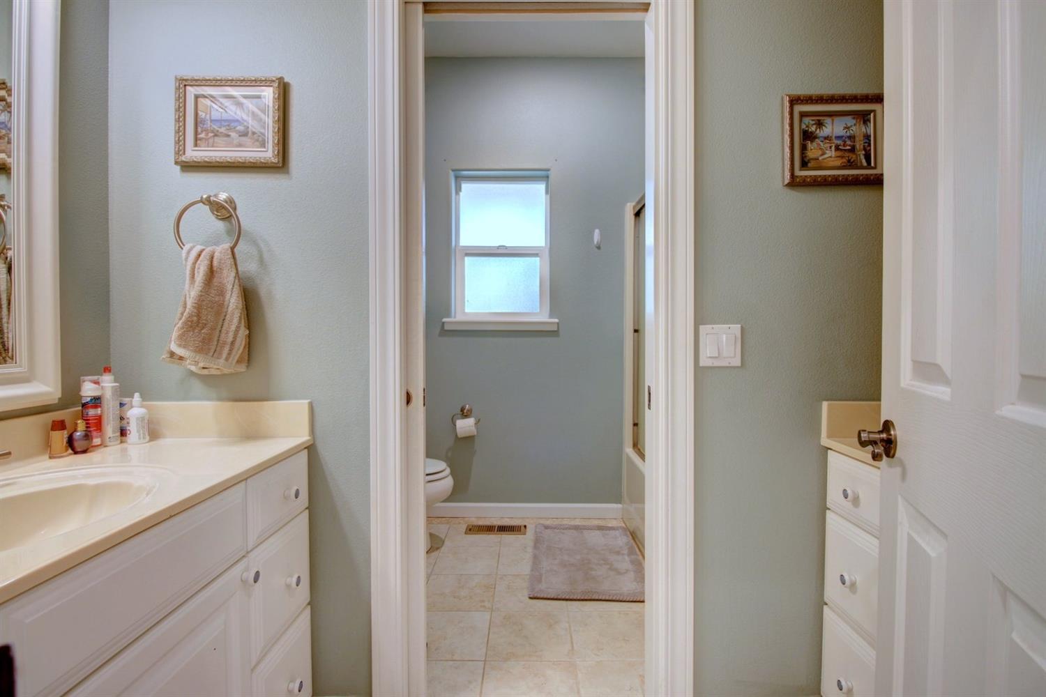 1065 Riessen Road Grants Pass, OR 97526 - Photo 17 of 32 a bathroom with a sink vanity and a mirror