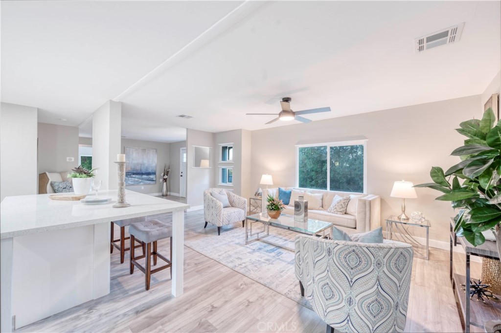 26345 Scott Road Menifee, CA 92584 - Photo 1 of 1 a living room with furniture and a large window