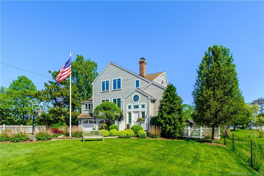 599 Old Dam Road Fairfield, CT 06824 - Photo 1 of 1 a front view of a house with a yard