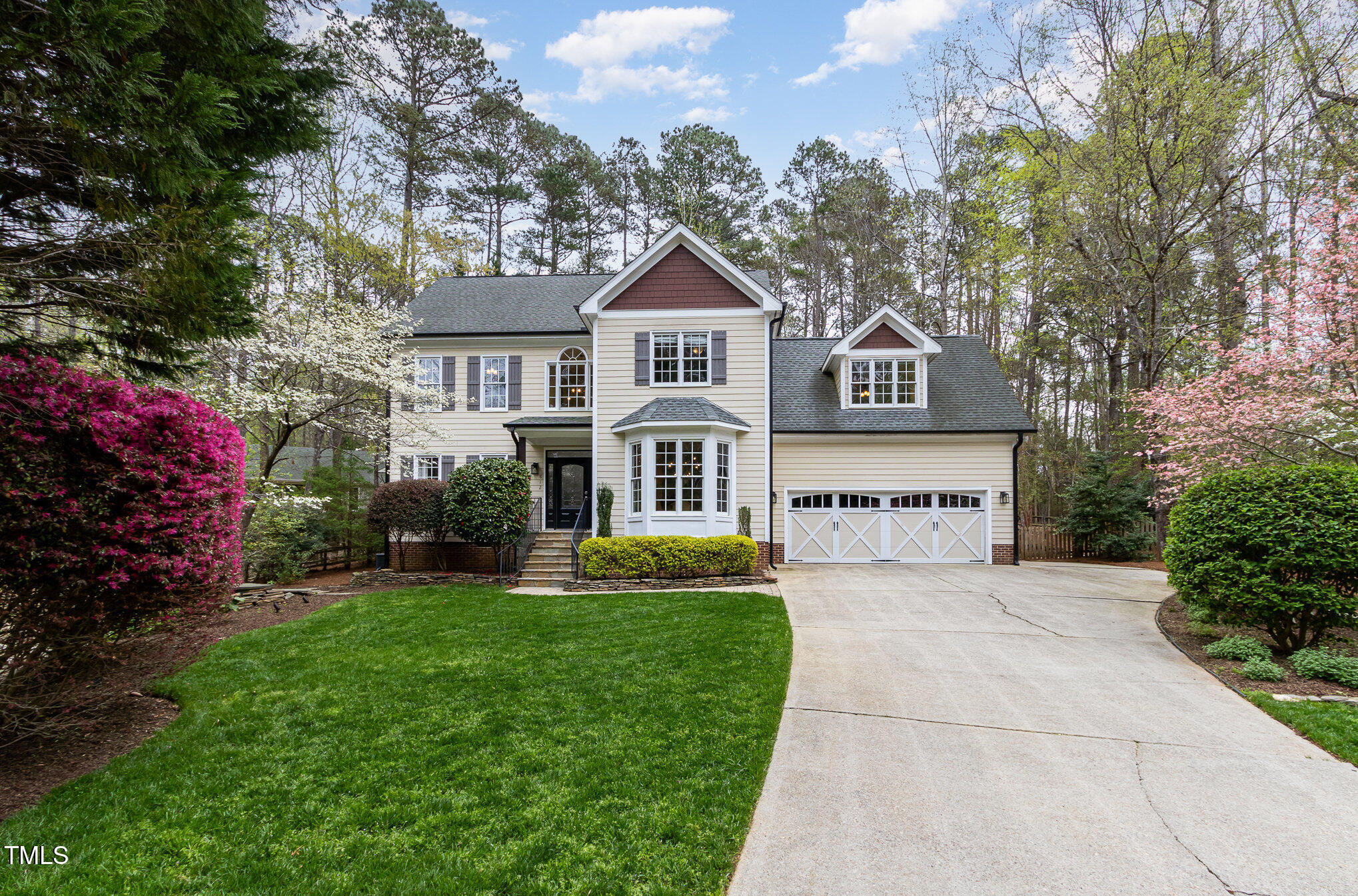 812 Oxgate Circle Raleigh, NC 27615 - Photo 2 of 3 a front view of a house with a yard and garage