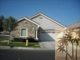 49829 Wayne Street Indio, CA 92201 - Photo 1 of 24 a front view of a house with a yard