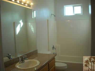 49829 Wayne Street Indio, CA 92201 - Photo 15 of 24 a bathroom with a sink a toilet and shower