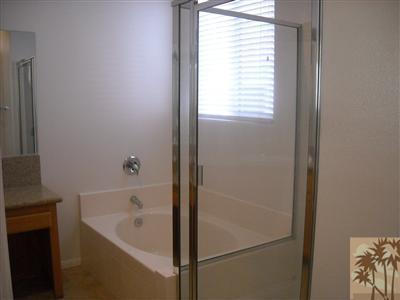 49829 Wayne Street Indio, CA 92201 - Photo 19 of 24 a bathroom with a bathtub and a window