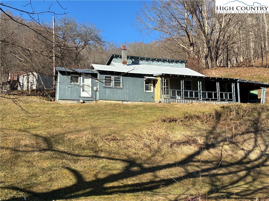 838 Rock Creek Road Creston, NC 28615 - Photo 1 of 21 a front view of a house with a yard