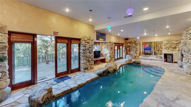 a living room with lots of furniture and a large window