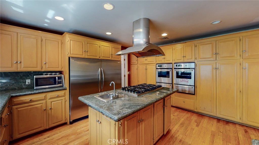 1248 Rocky Road Simi Valley, CA 93063 - Photo 15 of 71 a kitchen with stainless steel appliances granite countertop a sink a stove and a refrigerator