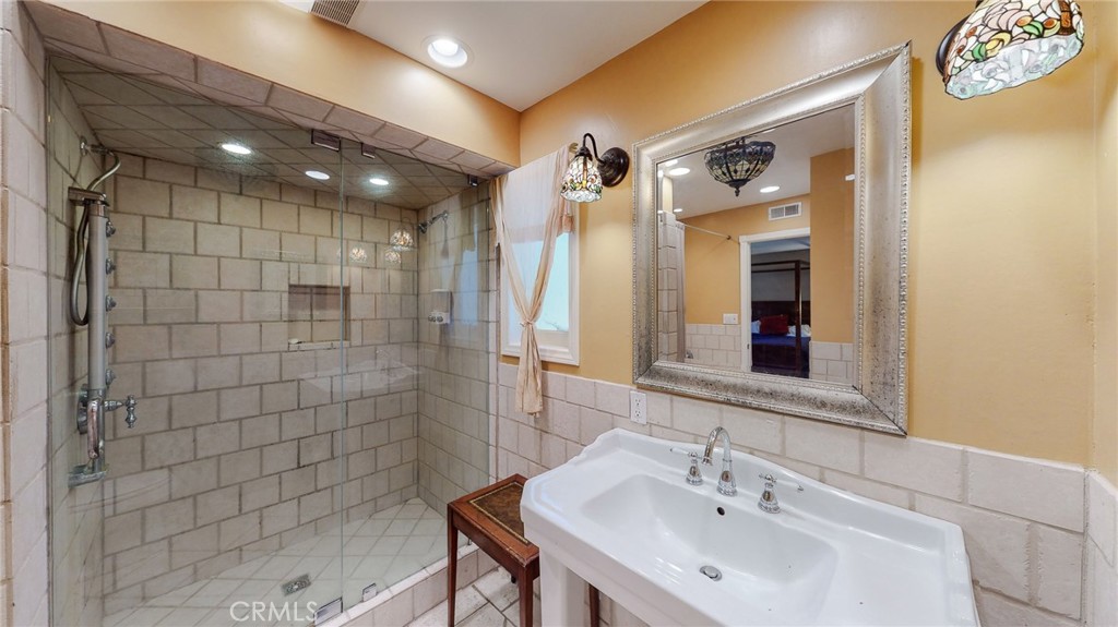 1248 Rocky Road Simi Valley, CA 93063 - Photo 21 of 71 a bathroom with a sink shower and a mirror