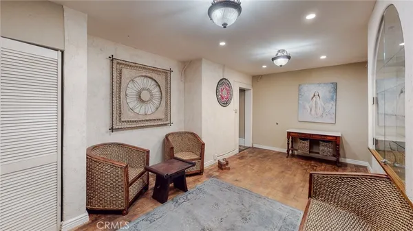 a living room with furniture and a rug